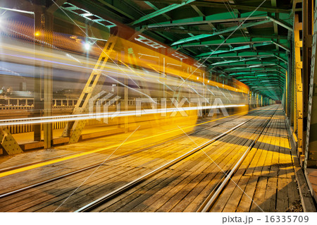 Steel Truss Bridge with Tram Light Trail 16335709