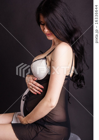 Pregnant girl is wearing sexy black negligee 16336644