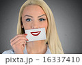 Woman holding card with smile sketch 16337410