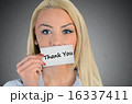 Woman holding card with Thank you word 16337411