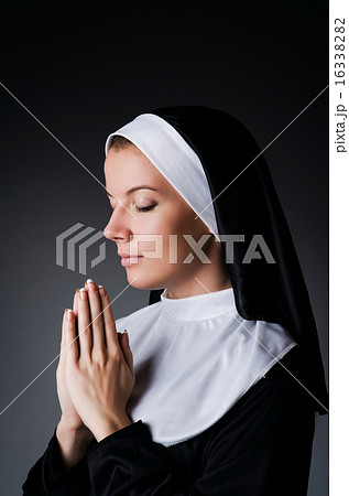 Young nun in religious concept 16338282