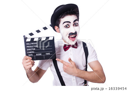 Man with movie clapper isolated on white 16339454