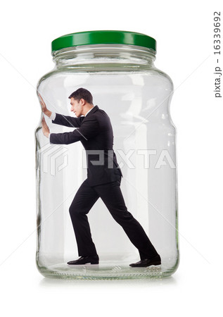 Young businessman in glass jar Young businessman in glass jar 16339692