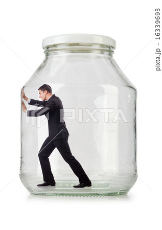 Young businessman in glass jar Young businessman in glass jar 16339693