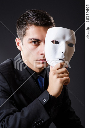 Man with mask in the dark Man with mask in the dark 16339696