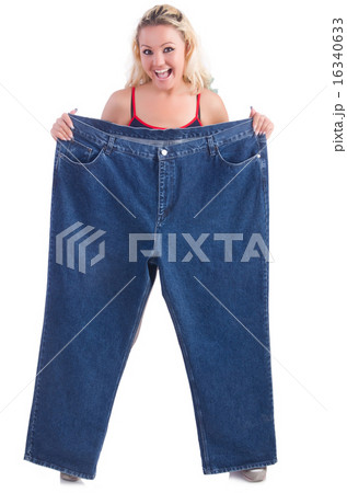 Woman in dieting concept with big jeans Woman in dieting concept with big jeans 16340633