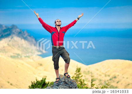 Man on top of mountain Man on top of mountain 16341033