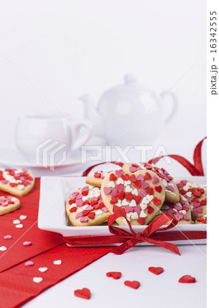 Valentines Day cookies, cup and teapot on white 16342555