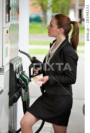 woman at gas station woman at gas station 16348131