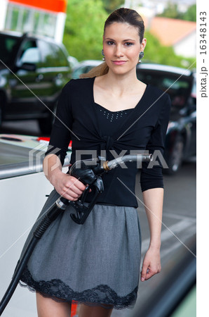 woman in petrol station woman in petrol station 16348143