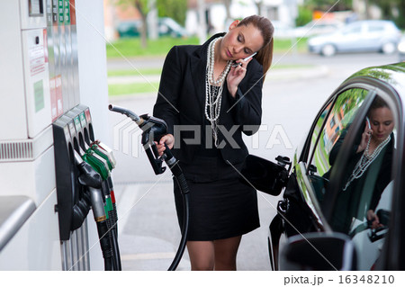 elegant woman in gas station 16348210