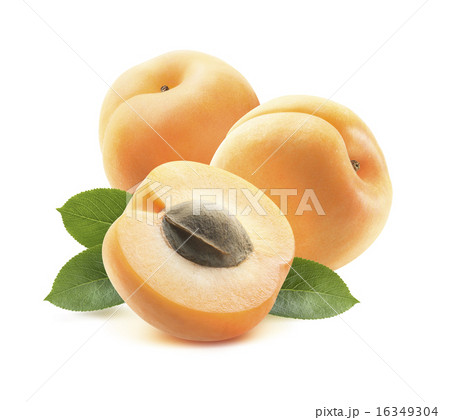 Two whole apricots and half with seed 2 isolated 16349304