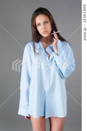 beautiful young brunette woman with cigarette beautiful young brunette woman with cigarette 16361909