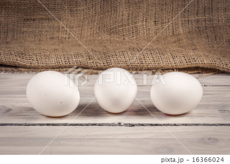 Three eggs on a wooden table Three eggs on a wooden table 16366024
