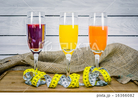 Juice with measure tape wooden table Juice with measure tape wooden table 16366082