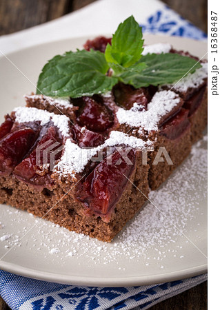 sliced piece of plum cake with cocoa sliced piece of plum cake with cocoa 16368487