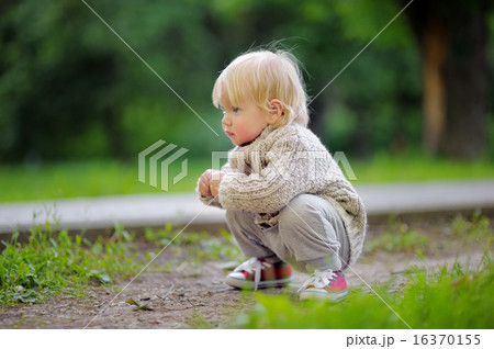 Toddler playing at the park 16370155