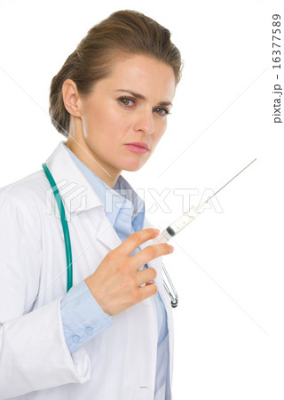 Serious medical doctor woman with syringe 16377589
