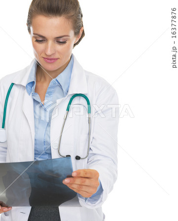 Thoughtful doctor woman checking fluorography Thoughtful doctor woman checking fluorography 16377876