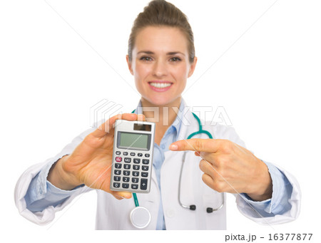 Closeup on doctor woman pointing on calculator 16377877