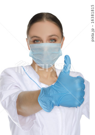 Doctor in mask and gloves with gesture OK 16381815