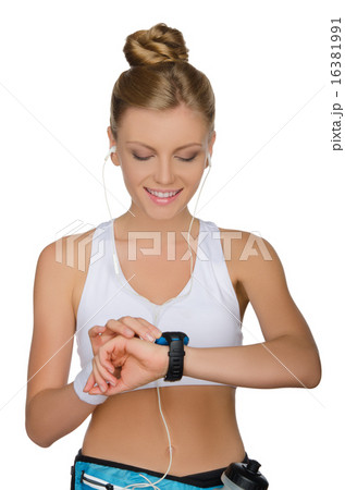 young woman with headphones and clock young woman with headphones and clock 16381991