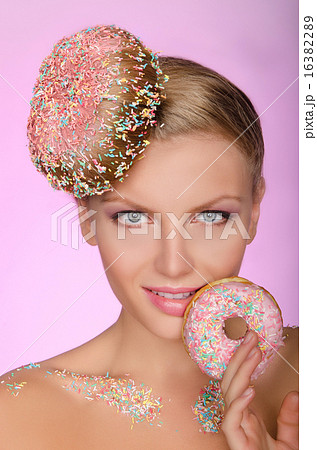 charming woman with creative hairstyle from donut charming woman with creative hairstyle from donut 16382289