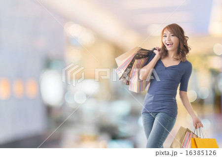 Cheerful shopping woman 16385126