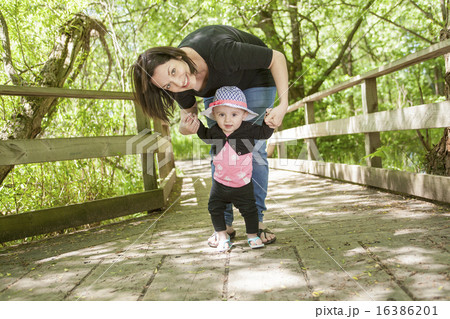 Mother and daughter in forest Mother and daughter in forest 16386201