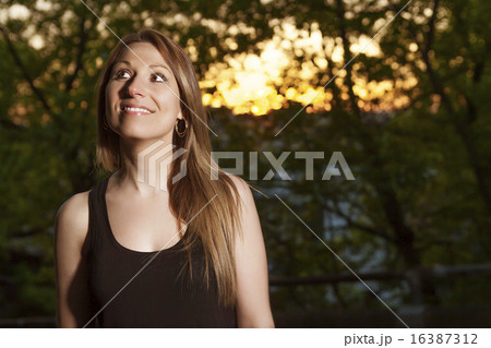 Young beautiful woman portrait sunset 16387312