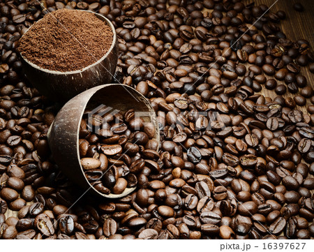 wooden cup with coffee beans 16397627