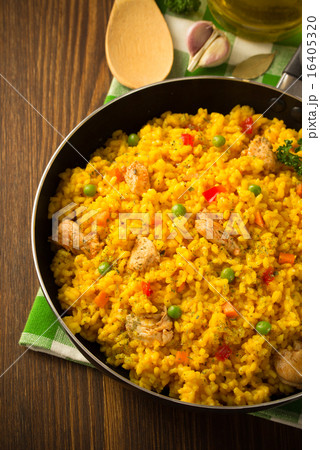 frying pan full of rice on wood 16405320