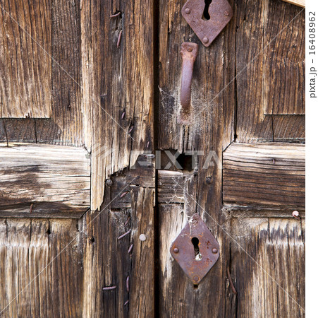 closed wood door  albizzate varese italy 16408962