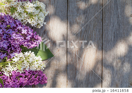 Colorful lilac flowers on garden table 16411658