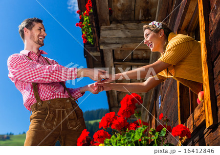 Couple in love at mountain hut window Couple in love at mountain hut window 16412846