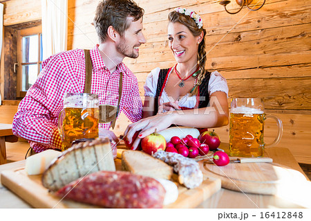 Couple having dinner at mountain hut in alps Couple having dinner at mountain hut in alps 16412848