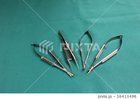 Four Eye surgery tools on blue surgical drape Four Eye surgery tools on blue surgical drape 16413496