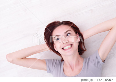 young happy woman lying young happy woman lying 16418567