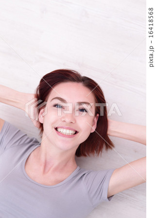 young happy woman lying young happy woman lying 16418568