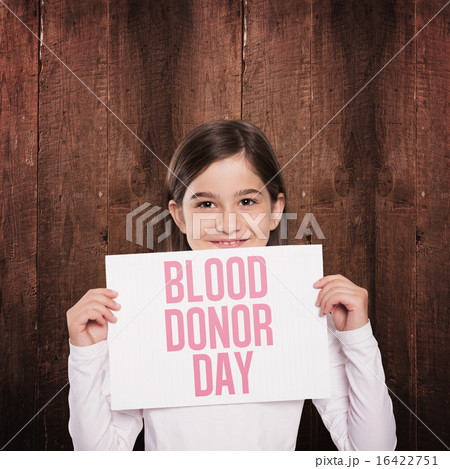 Composite image of cute little girl showing card 16422751