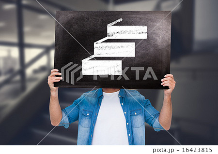 Composite image of casual man showing board 16423815