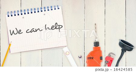 We can help against tools and notepad on wooden background We can help against tools and notepad on wooden background 16424585