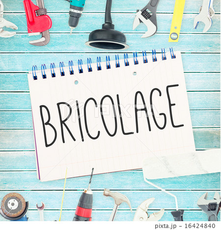 Bricolage against tools and notepad on wooden background Bricolage against tools and notepad on wooden background 16424840