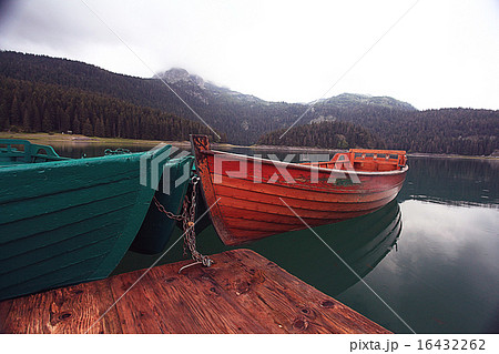 wooden boat on a mooring mountain lake wooden boat on a mooring mountain lake 16432262