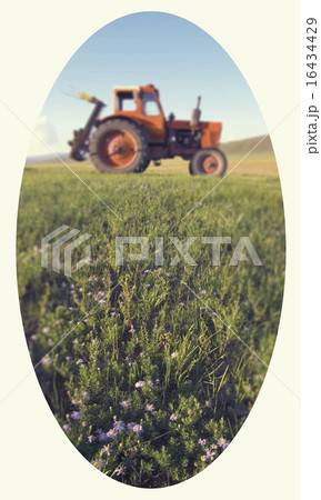 Side View Of A Tractor In A Scenic View Side View Of A Tractor In A Scenic View 16434429