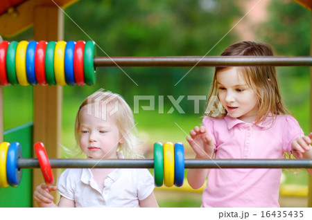 Two little sisters learning to count 16435435