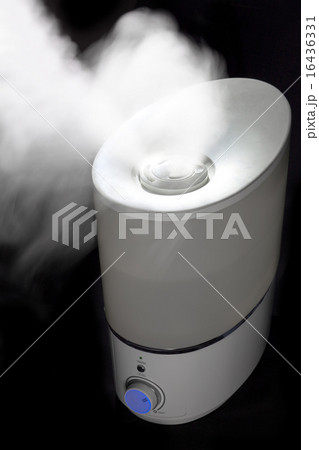 Humidifier spreading steam in darkness Humidifier spreading steam in darkness 16436331