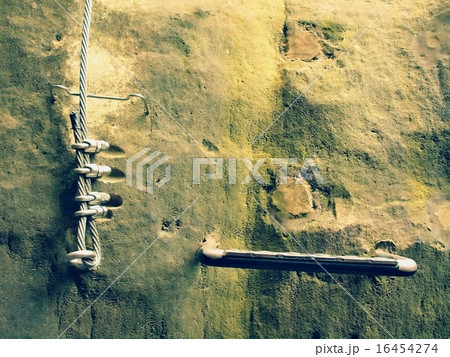 Twisted rope fixed in block by screws snap hooks. Twisted rope fixed in block by screws snap hooks. 16454274
