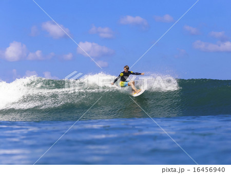 Surfing a wave, Bali, Indonesia. 16456940