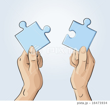 Two hands holding pieces of the puzzle 16473934